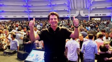 harv eker on stage two thumbs up