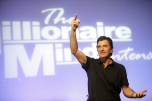 T. Harv Eker on stage teaching top 10 life lessons