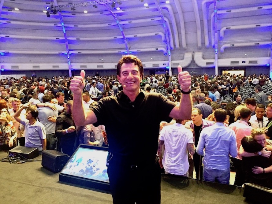 harv eker on stage two thumbs up