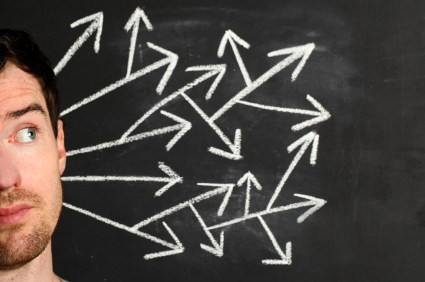 white arrows coming out of mans head on chalk board