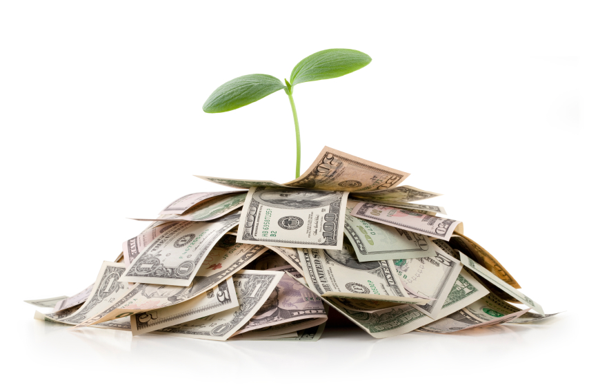 planet sprouting from money
