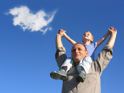 dad with child on shoulders