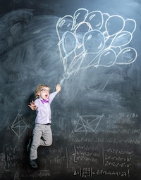 child with balloons on chalk board
