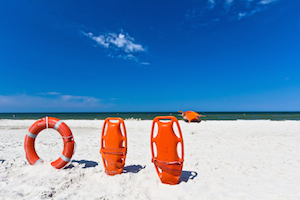 floats stuck in sand on beach