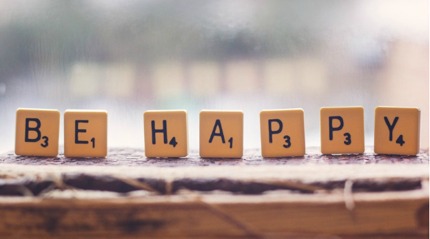be happy spelled out scrabble letters