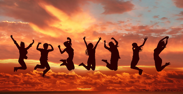 silhouettes of people jumping in the air