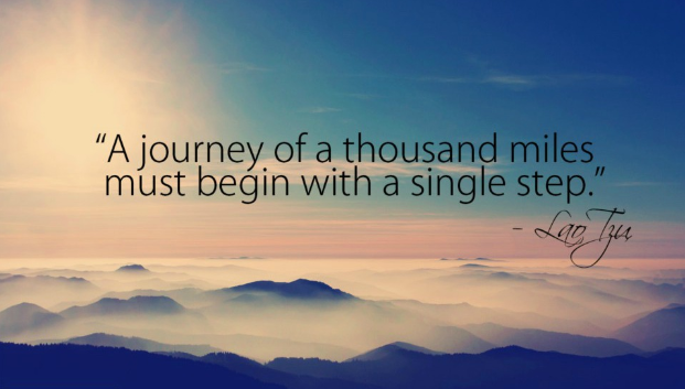 inspirational quote over mountains and clouds