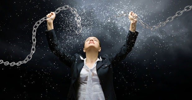woman breaking chains in half