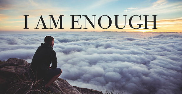 man standing above cloud on mountain