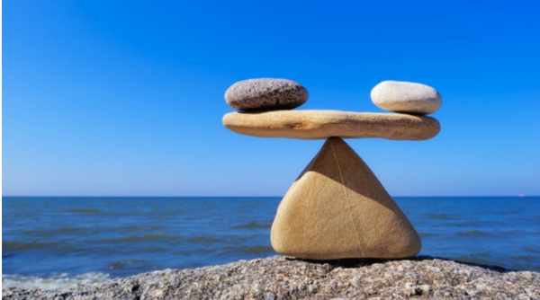 river rocks stacked in formation near ocean