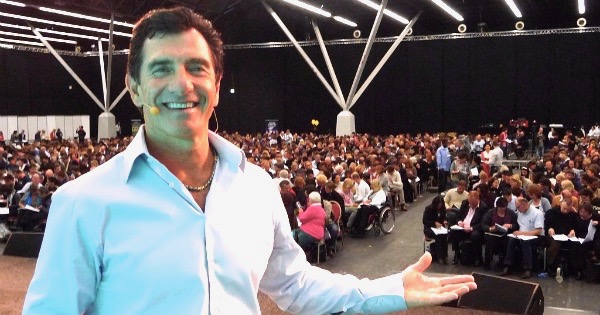 T. Harv Eker on stage smiling