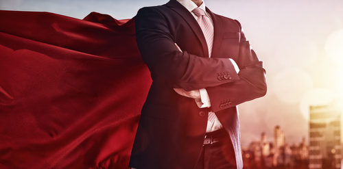 businessman in a red cape in city